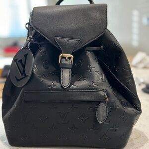 Black Backpack with Flap Closure and Adjustable Straps